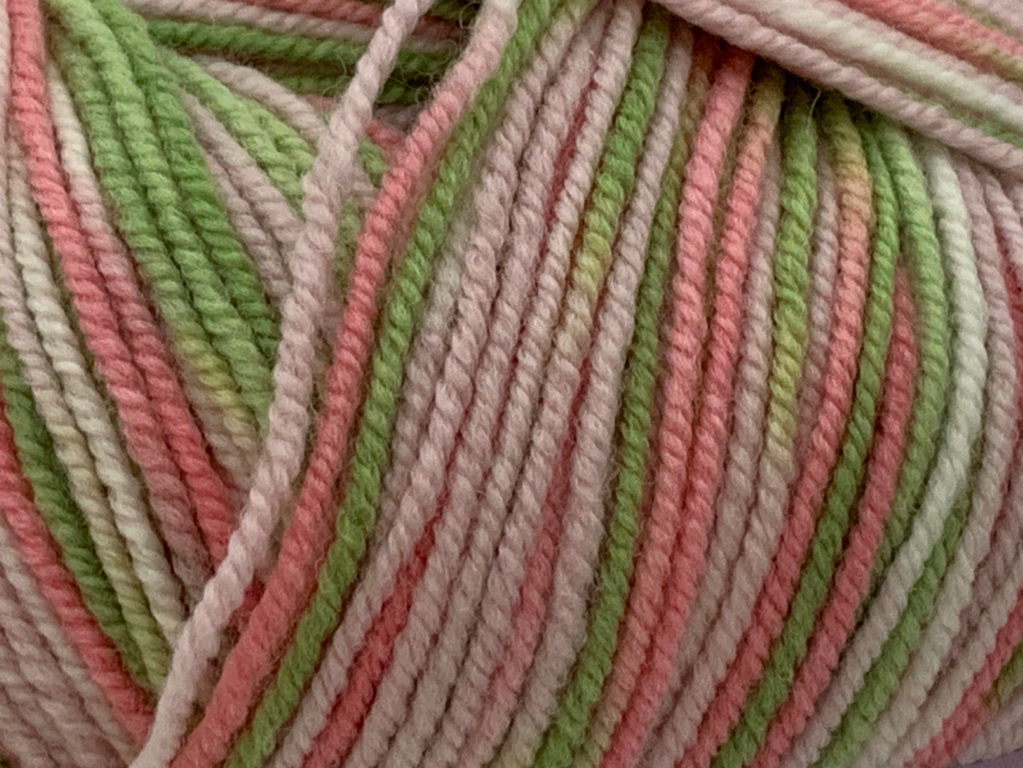 Close up of Superfine Merino wool in light pink/green multicolour "Apple Blossom"