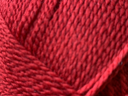 Close up of Superfine Merino wool in deep red "Hawthorn" colour