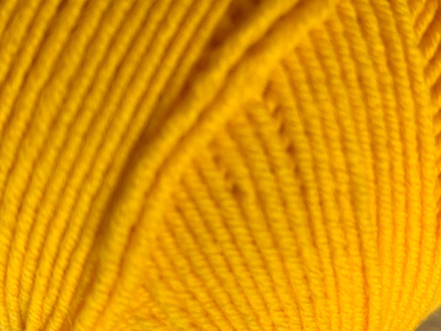 Yellow "Everlasting" ball of superfine 4 ply Merino closeup.