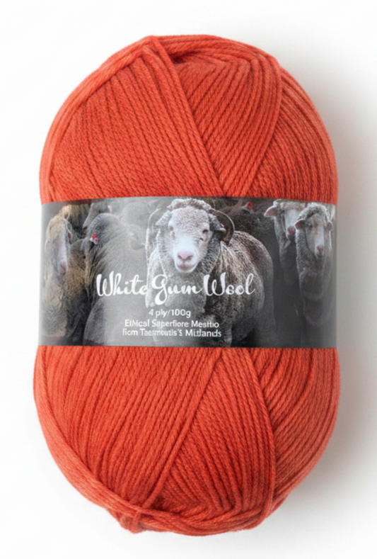 Red "Flame" colour ball of superfine 4 ply Merino on white background