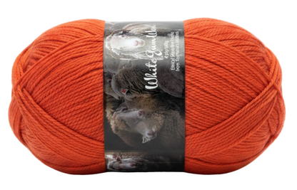 "Flame" red ball of superfine 4 ply Merino on white background