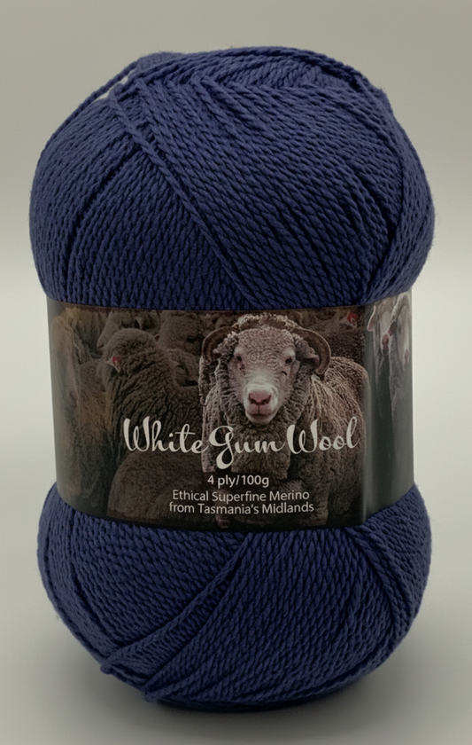 Dark grey blue "Storm" coloured ball of superfine 4 ply Merino on white background