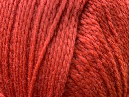Close up of Superfine Merino 4 ply  in Red "Flame" colour